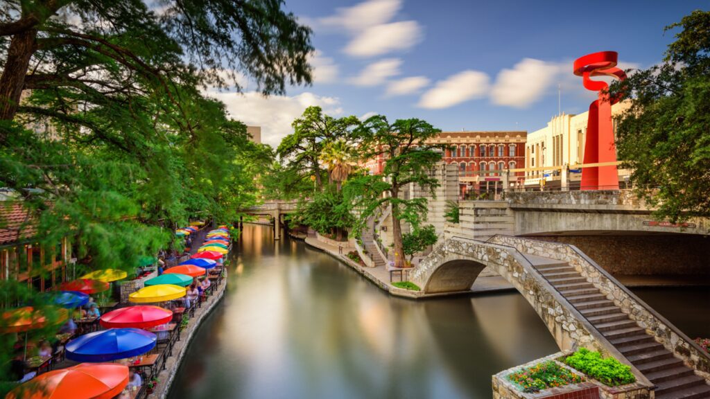 Inside image of a house along with a river and some people sitting